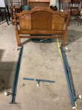 Vintage wood queen size headboard and metal rolling bed rails set, approx 60 x 48 x 70 in.
