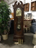 Howard Miller Clock Co. grandfather clock w/ pendulum, 3 weights, door key, clock key and 3 loose