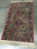 Vintage wool rug with fringe, approximately 35 x 69 in.