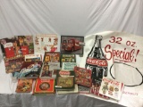 Lot of Coca-Cola history coffee table books, magazines, calendars, sign, delivery truck photo