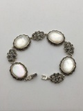 Fine vintage Sterling Silver bracelet with inlayed mother of pearl caps.