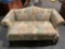 Modern love seat w/ multicolor pastel floral upholstery, approx 32 x 31 x 63 in.