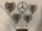 Collection of five automobile hood ornaments, 4x Cadillac, 1x Mercedes.