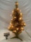Small decorative Christmas tree with yellow lights, tested and working, approximately 12 by 24 in.