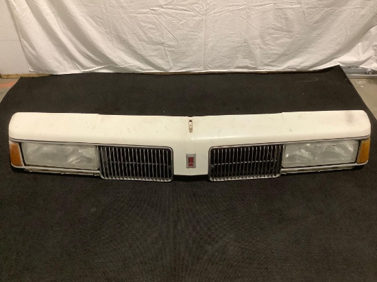 Oldsmobile - Cutlass (1987?) grill w/ emblem & headlight housing , approx. 65 x 9 x 6 in. Sold as