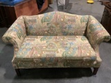 Modern love seat w/ multicolor pastel floral upholstery, approx 32 x 31 x 63 in.