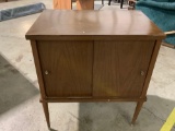 Vintage sliding door cabinet, approx 23 x 15 x 26 in. Shows wear.