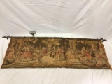 Woven tapestry on hanger bar, Victorian romantic courtyard scene, approx 63 x 19 in.