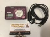 Nikon Coolpix Digital camera with cable, untested, sold as is.