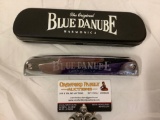 The original blue Danube harmonica with case, approximately 8 x 2 x 2 in.