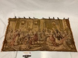 Woven tapestry with metal hanger rings image of Victorian party, made in Belgium, approx 34 x 18 in.