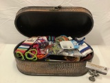 Modern jewelry box stuffed full of hair ties, approximately 15 x 7 x 5 in.