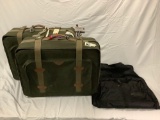 3 pc. luggage lot; 2 Adolfo canvas suitcases showing wear, Kirkland suit bag. Sold as is.