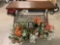 Modern metal frame display table w/ 2 faux flower arrangement hanging baskets