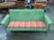 Green painted metal patio gliding rocker couch, approx 70 x 30 x 33 in.