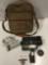 Vintage Bell and Howell film movie camera with lens and bag, sold as is.