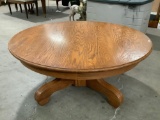 Vintage round wood coffee table, approx 42 x 18 in. Solid construction.