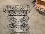 Vintage metal wire plant stand display rack in shape of a rolling carriage, approx 33 x 10 x 24 in.