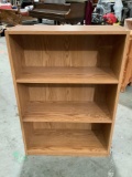 Modern bookshelf with three shelves, shows wear , approx 25 x 10 x 36 in.