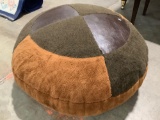Large stuffed ottoman pillow, shows where, approximately 35 x 18 in. Sold as is.