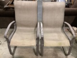 Pair of modern outdoor rocking patio/ deck chairs, shows wear, approx 24 x 24 x 40 in.