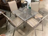 5 pc. patio furniture set: metal table and 4 chairs, approx 36 x 36 x 29 in.