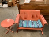 2 pc. lot pink painted metal patio gliding rocker couch and side table, approximately. 53 x 27 x 35