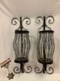 Pair of wall mounting metal candle holders w/ glass shades, 1 is cracked, approx 21 x 6 in. Sold as