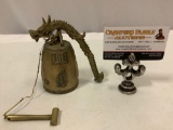 Chinese brass bell with ringer and dragon shaped hanger, approx 5 x 5 x 3 in.