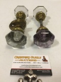 Two sets of vintage brass and glass door knobs, approximately 2 x 6 in.