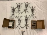 6 pc. lot of metal wire candle holders w/ 2 cases of candles. Approx 8 x 14 x 4 in.