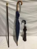 2x vintage umbrellas and a walking cane with a hidden cigar holder see pics
