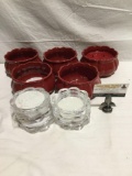 Nice selection of glass and plastic candle holders one with candle