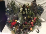 Large selection of faux flowers, fruit, and assorted arrangements