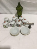 Collection of 7 unique fruit themed cups w/ lids and 7 saucers plus a green candy jar
