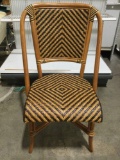 Nicely crafted bamboo wicker chair with two tone woven seat and back, approx 22 x 36 x 19 in.
