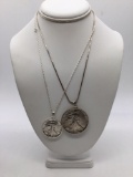 1945 silver half dollar and a 1987 .999 silver eagle both in silver bezels on sterling chains