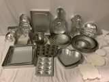 Huge collection of Wilton cake baking pans and plastic cake stands, cake molds: tiger cub, guitar,