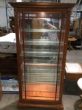 Modern wood side loading lighted display cabinet, approximately 39 x 81 x 14 in. Tested/working.