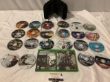 Collection of 24 Microsoft XBOX ONE video game discs in binder, 2 w/ case. HALO, GTA 4, Tomb Raider