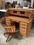 Vintage oak 2-piece roll top filing desk w/ rolling wood chair, approx 54 x 25 x 47 in. Nice cond.