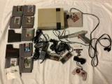 NES Nintendo video game console, 4 controllers, Zapper gun, cords, Jackal, Metal Gear, Castlevania,