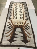 Vintage wool blanket with multicolor geometric Native American figure design, approx 37 x 97 in.