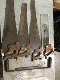 4 vintage hand saws 1 miter saw, and an antique no. 12 curved blade timber draw knife