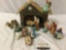 Vintage nativity scene holiday decoration set with painted ceramic figures, paper manger.