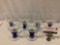 Set of 6 goblet style drinking glasses w/ blue stem, approx 4 x 6 in.