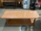 Vintage wood coffee table, approximately 60 x 23.5 x 15 in. Shows finish wear.