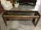Wood frame brown tinted glass top hall table, approximately 17 x 59 x 26 in. Nice condition. INV