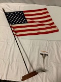 Vintage United States of America nylon flag w/ wood base and flagpole, approx 39 x 23 in.