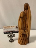 Beautiful wood carved sculpture of figures holding child, approx 3 x 9 in.